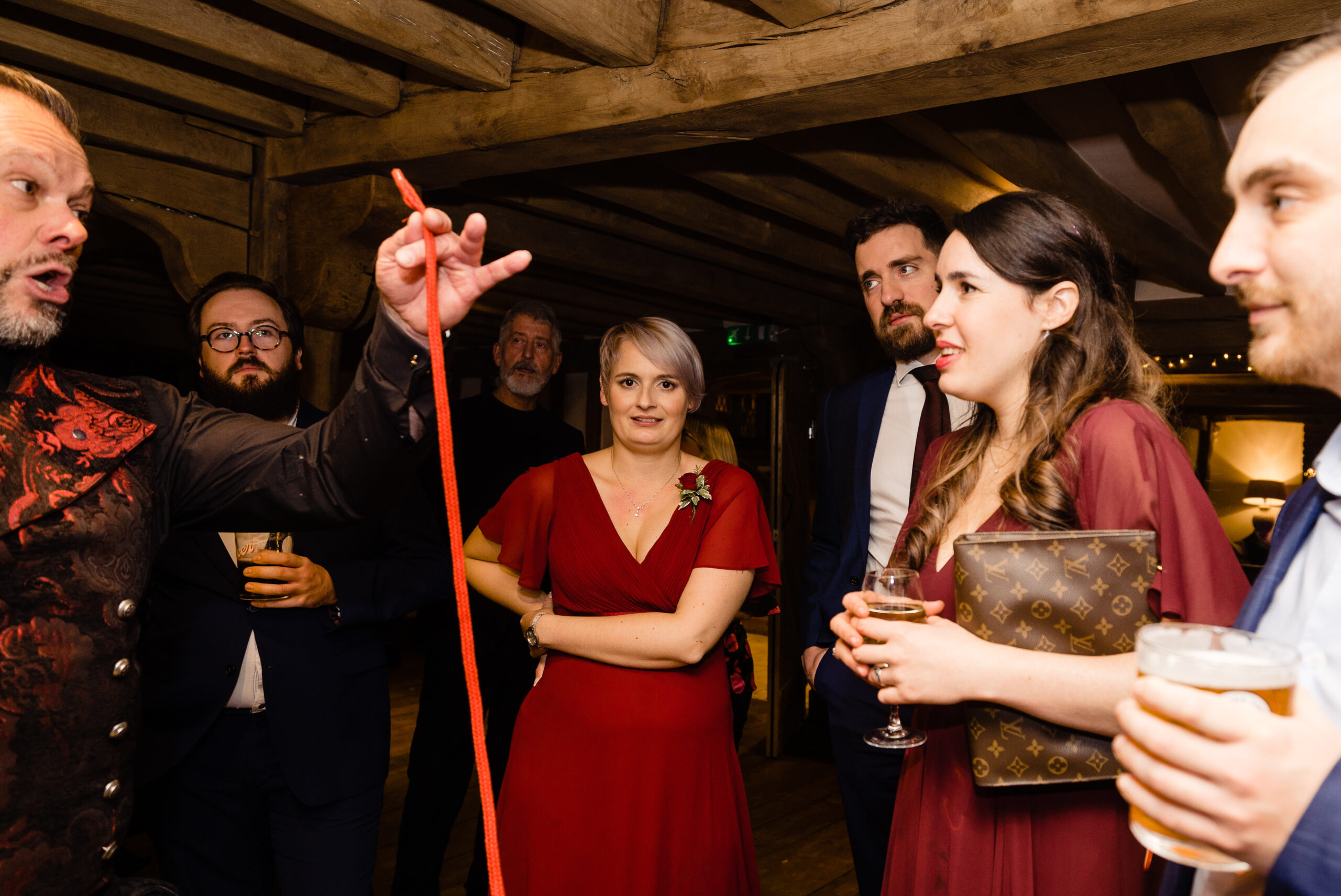 David Hitchcott performing close-up magic for guests at Cain Manor