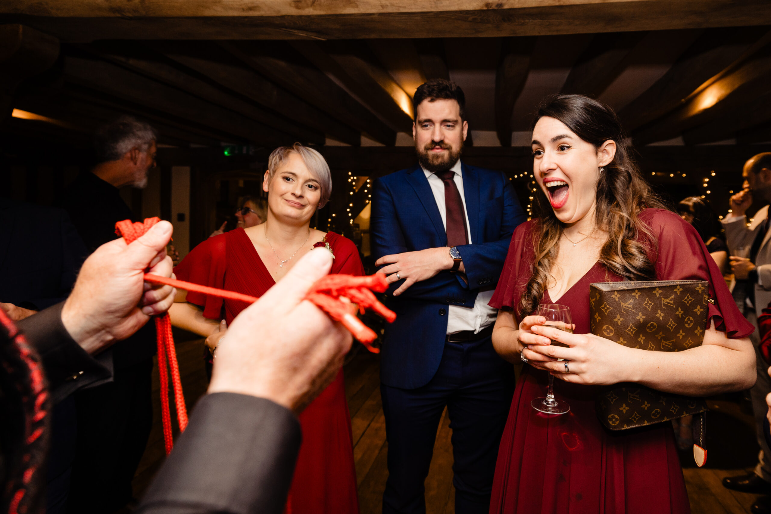 Wedding guest reacting to David Hitchcott's close-up magic